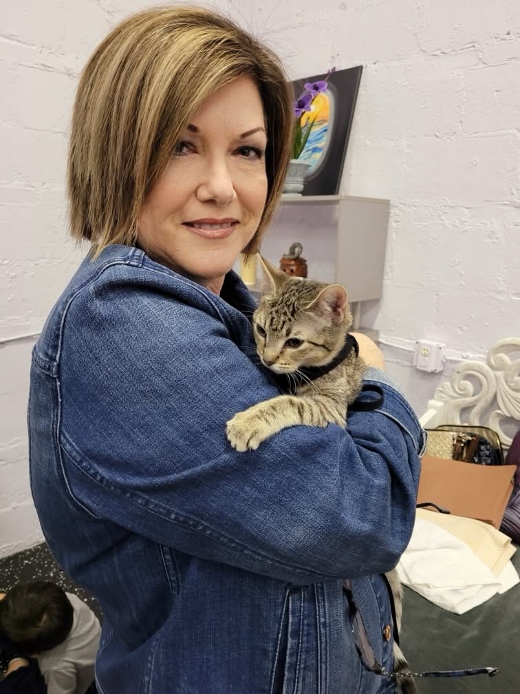 Volunteer holding a cat